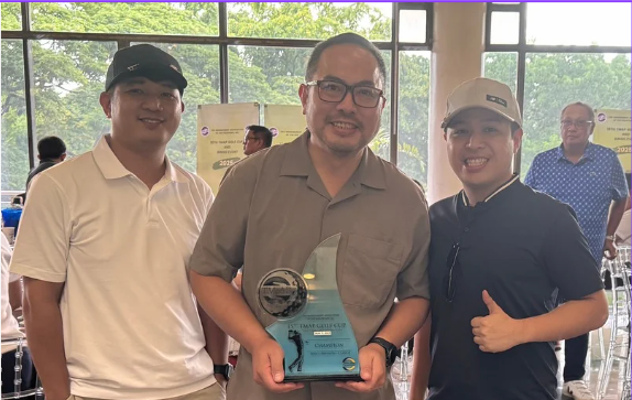 Partners Eljon and Fernando with Atty. Benedict R. Tugonon (center), Senior Partner of Quiason Makalintal Law Firm, who took home the Class A Champion title at the golf tournament.